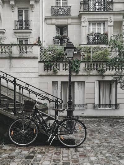 Photography print of Berlin displaying the architecture and bicycle as the focus point